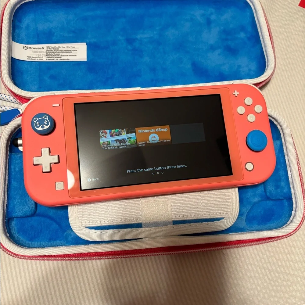 Nintendo Switch Lite Coral with Kirby Case